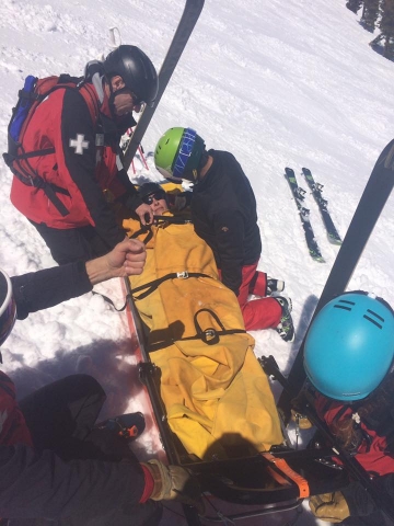A picture of Gina on Mount Rose being taken care of by Ski Patrol