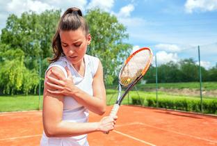 Young woman who hurt her shoulder playing tennis.