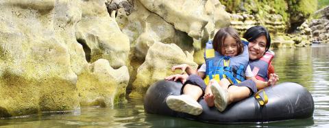 family tubing on river