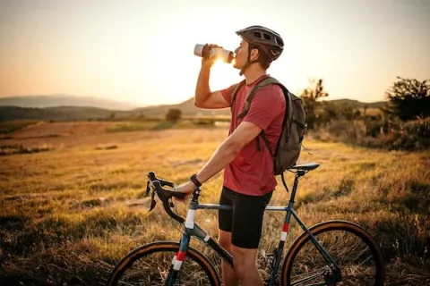 man cycling outdoors