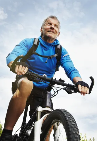 older man cycling