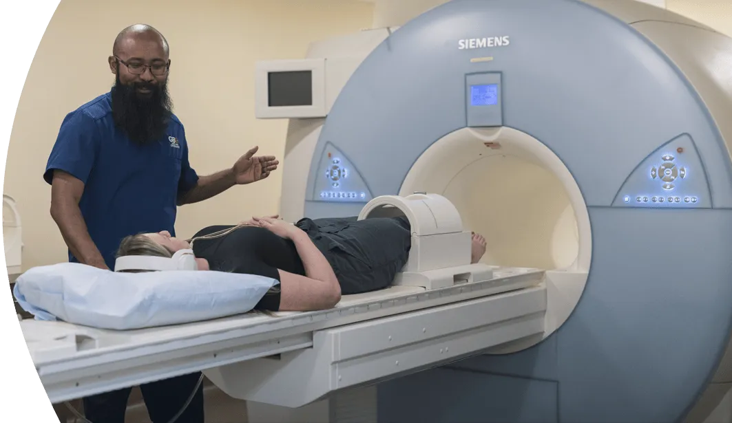 woman entering an MRI machine