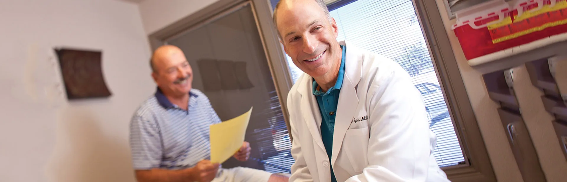 Photo of a doctor and smiling patient